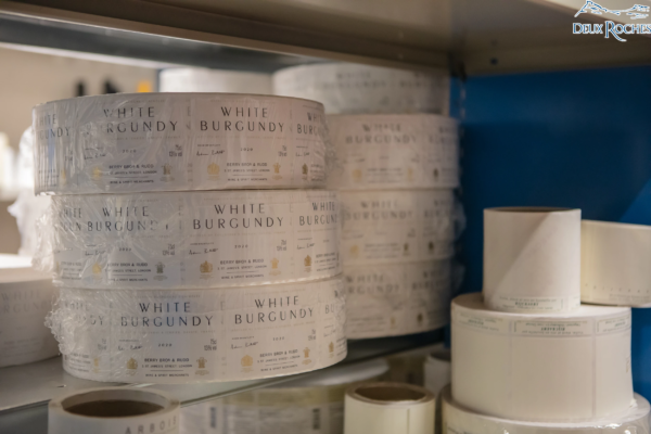 Wine label rolls – White Burgundy production Rolls of wine labels for White Burgundy bottles, stored on a shelf at Deux Roches winery.