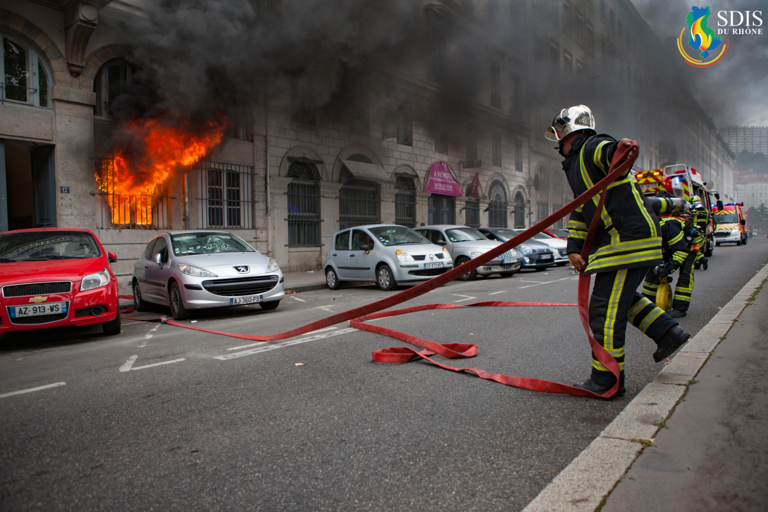 Firefighters from SDIS du Rhône responding to a residential fire in Lyon – photographed by a visual communication agency in Connecticut