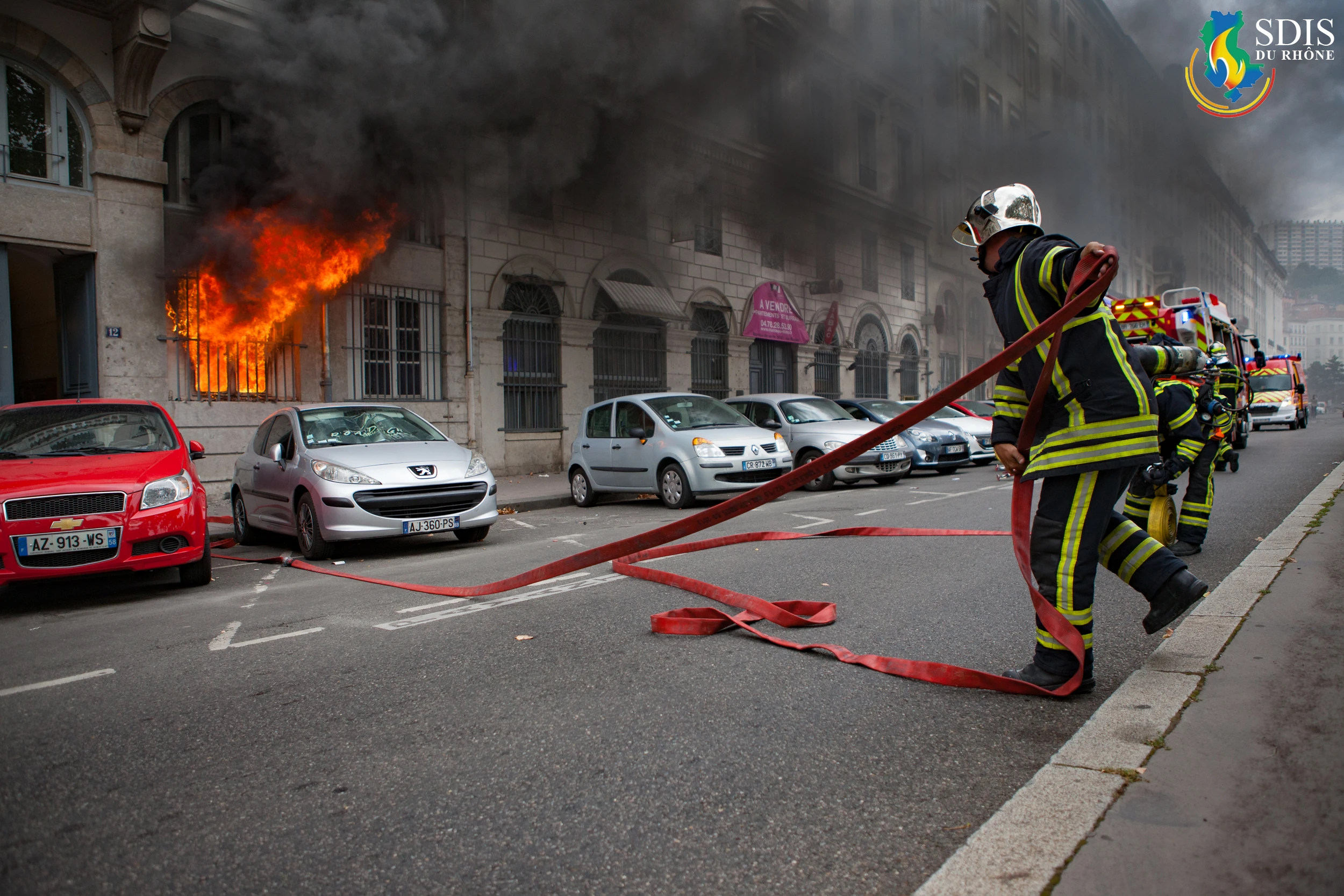 Firefighters from SDIS du Rhône responding to a residential fire in Lyon – photographed by a visual communication agency in Connecticut