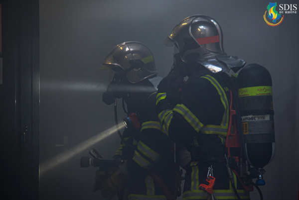 Fire investigation at Cité Internationale de Lyon Firefighters from SDIS du Rhône searching for a potential electrical fire in a smoke-filled basement.