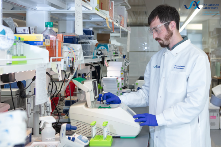 Researcher loading samples into a thermal cycler at The Jackson Laboratory