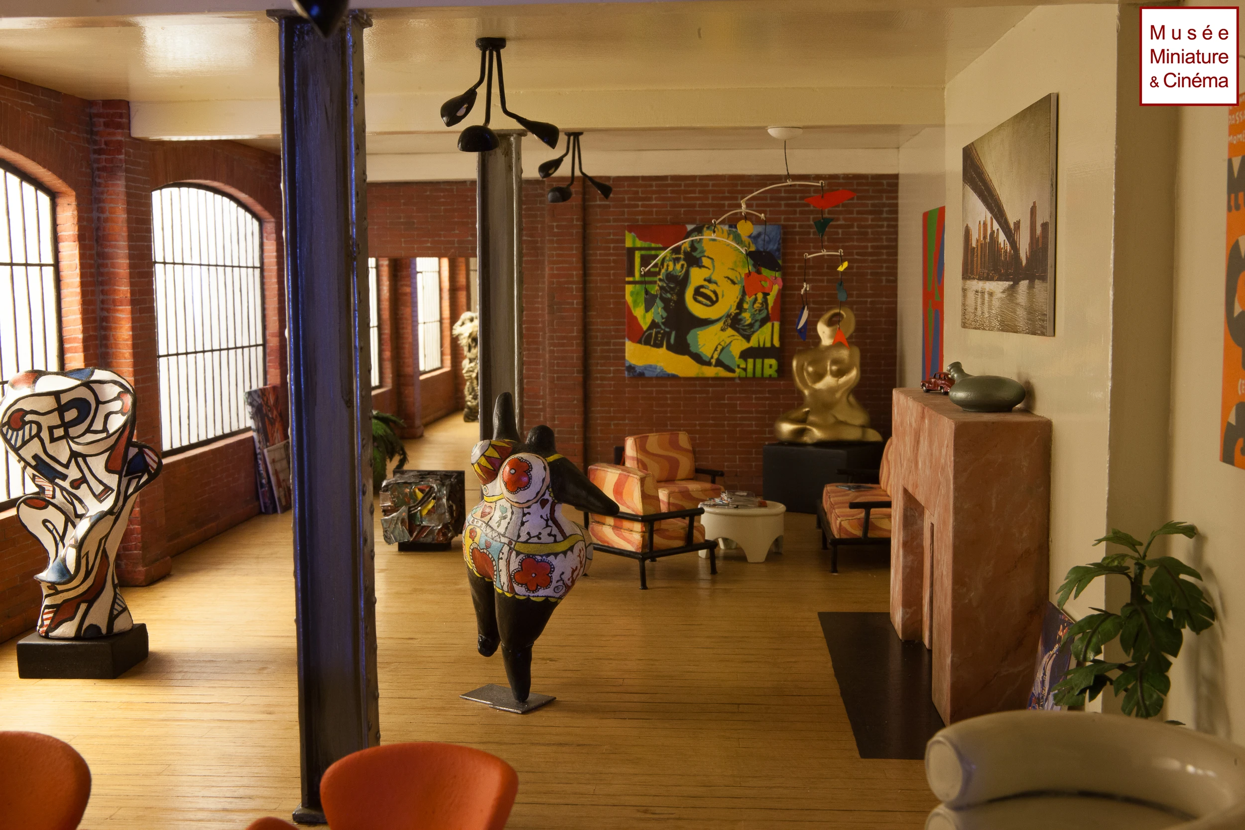 Miniature loft art gallery interior with sculptures and pop art, Musée Miniature et Cinéma, Lyon.