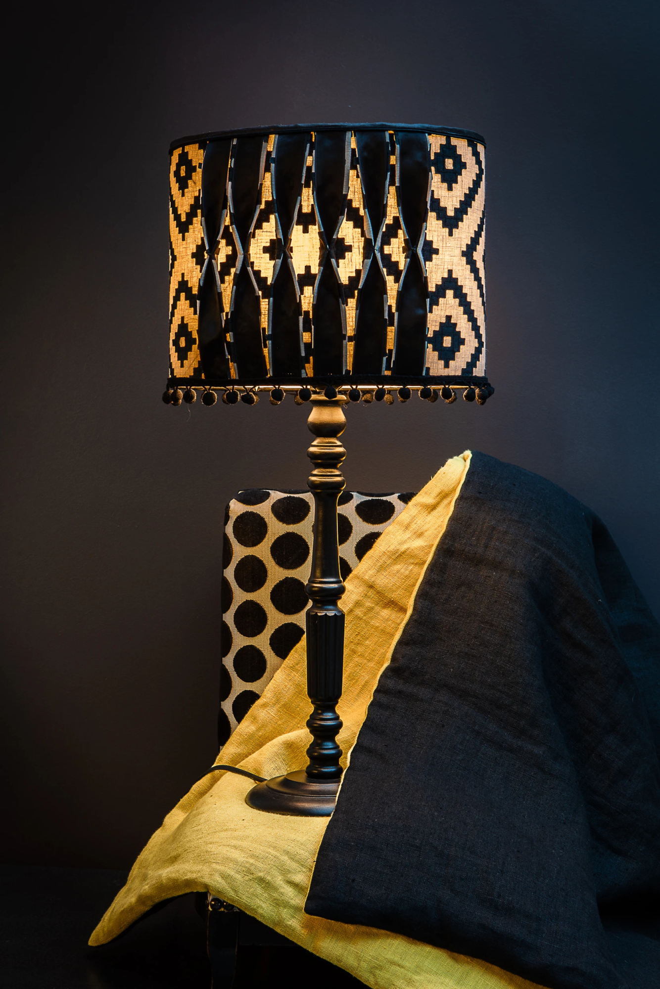 Black and yellow table lamp with geometric shade and matching textiles – Atelier Gris Mousse