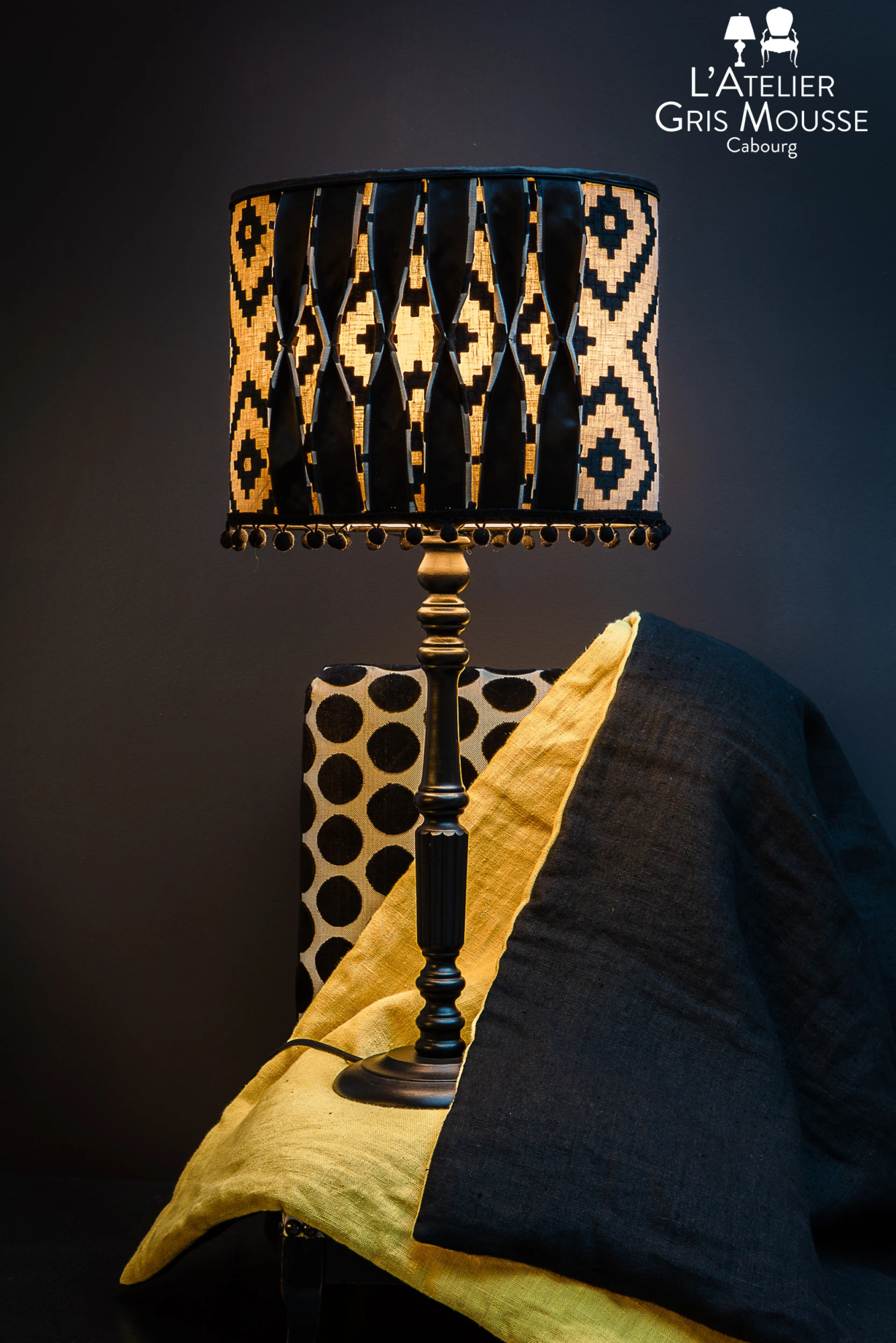 Black and yellow table lamp with geometric shade and matching textiles – Atelier Gris Mousse