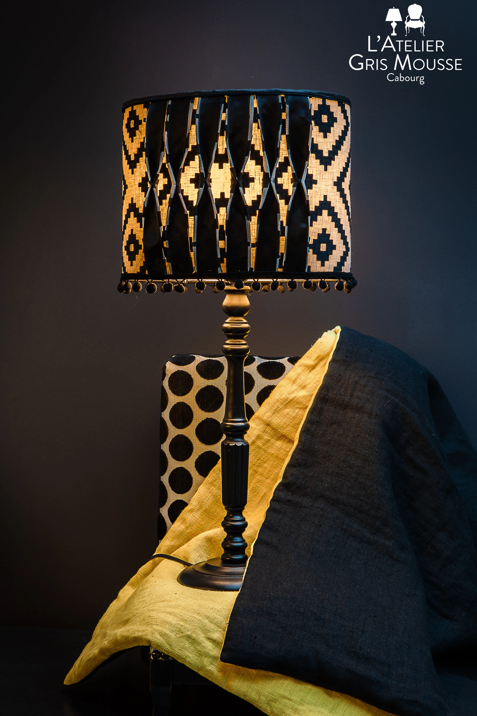 Black and yellow table lamp with geometric shade and matching textiles – Atelier Gris Mousse