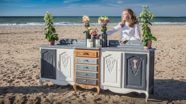 Romantic beach decor with repainted sideboard, flowers, and candles — creative visual identity for interior design by Atelier Gris Mousse.