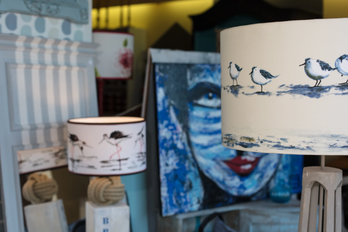 Decorative lampshades and painting styled in the boutique – creative visual identity for interior design