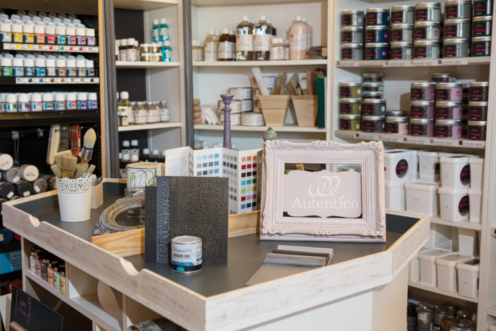 Paint display, color swatches, and brushes inside the boutique – creative visual identity for interior design
