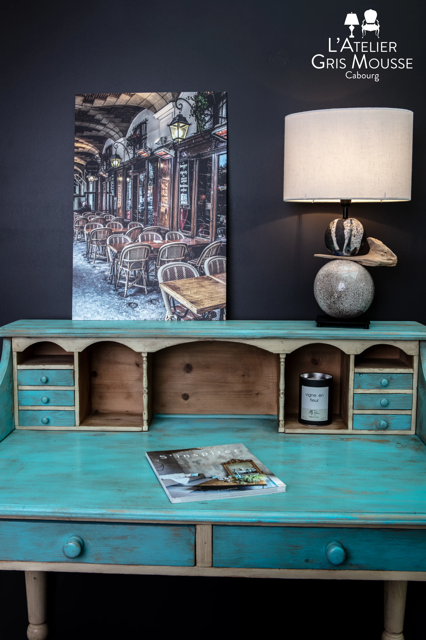 Patinated writing desk and decorative lamp styled in the boutique – creative visual identity for interior design