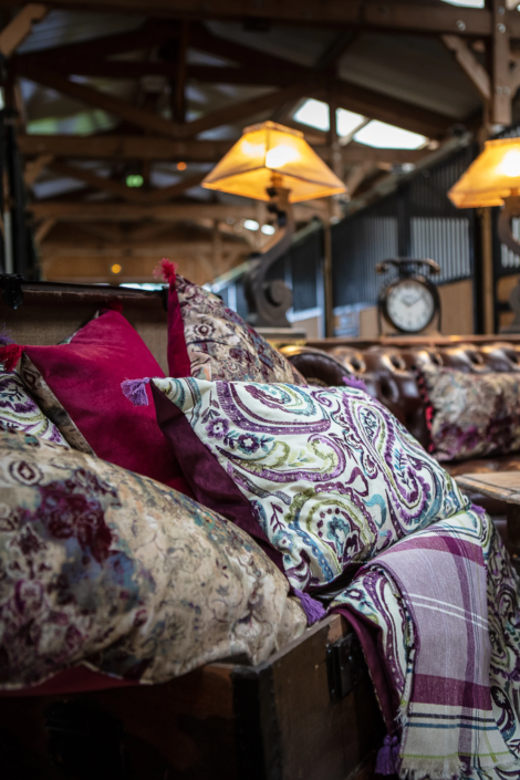 Restored vintage trunk filled with patterned cushions and fabrics – Atelier Gris Mousse interior design shoot