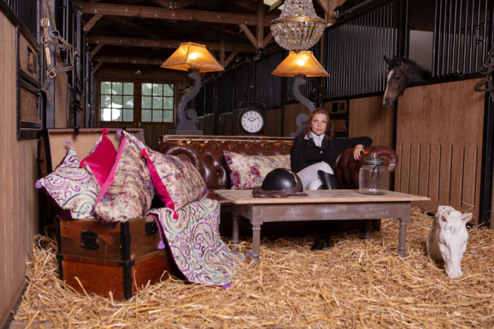 Interior design staging with rider, horse, and vintage decor in stable — creative visual identity by Atelier Gris Mousse.