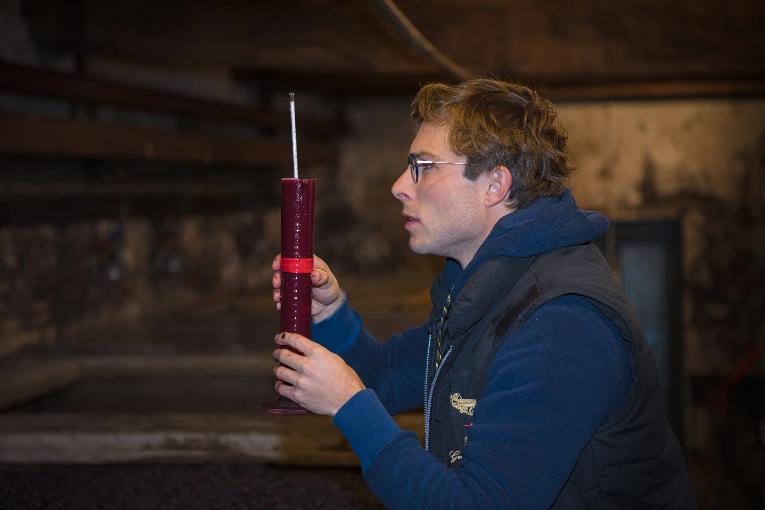 Vincent Gros measuring must density during fermentation at Gros Frère et Sœur winery