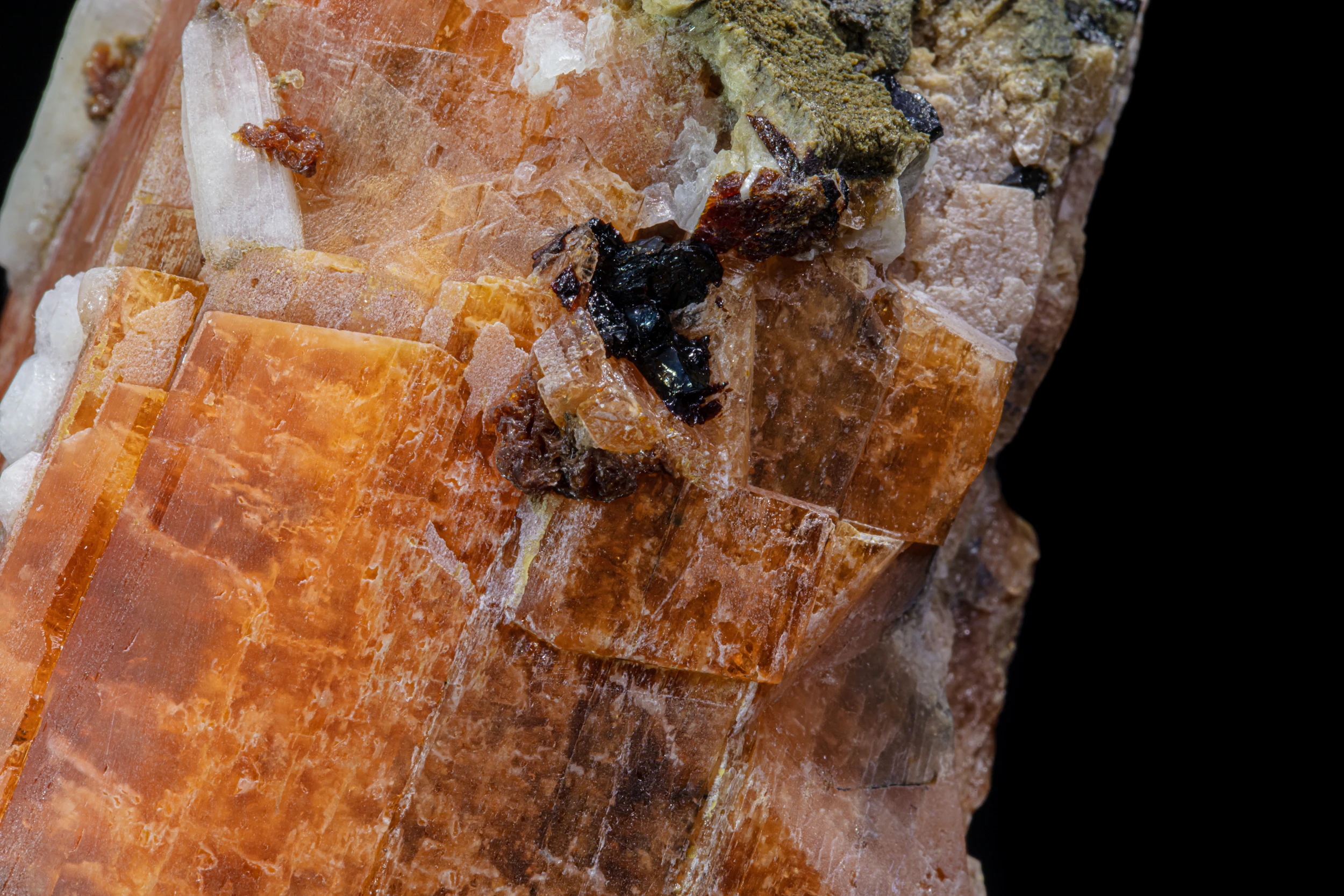 Extreme close-up of serandite crystal surface with fibrous and mineral inclusions – Poudrette Quarry, Québec, Canada.